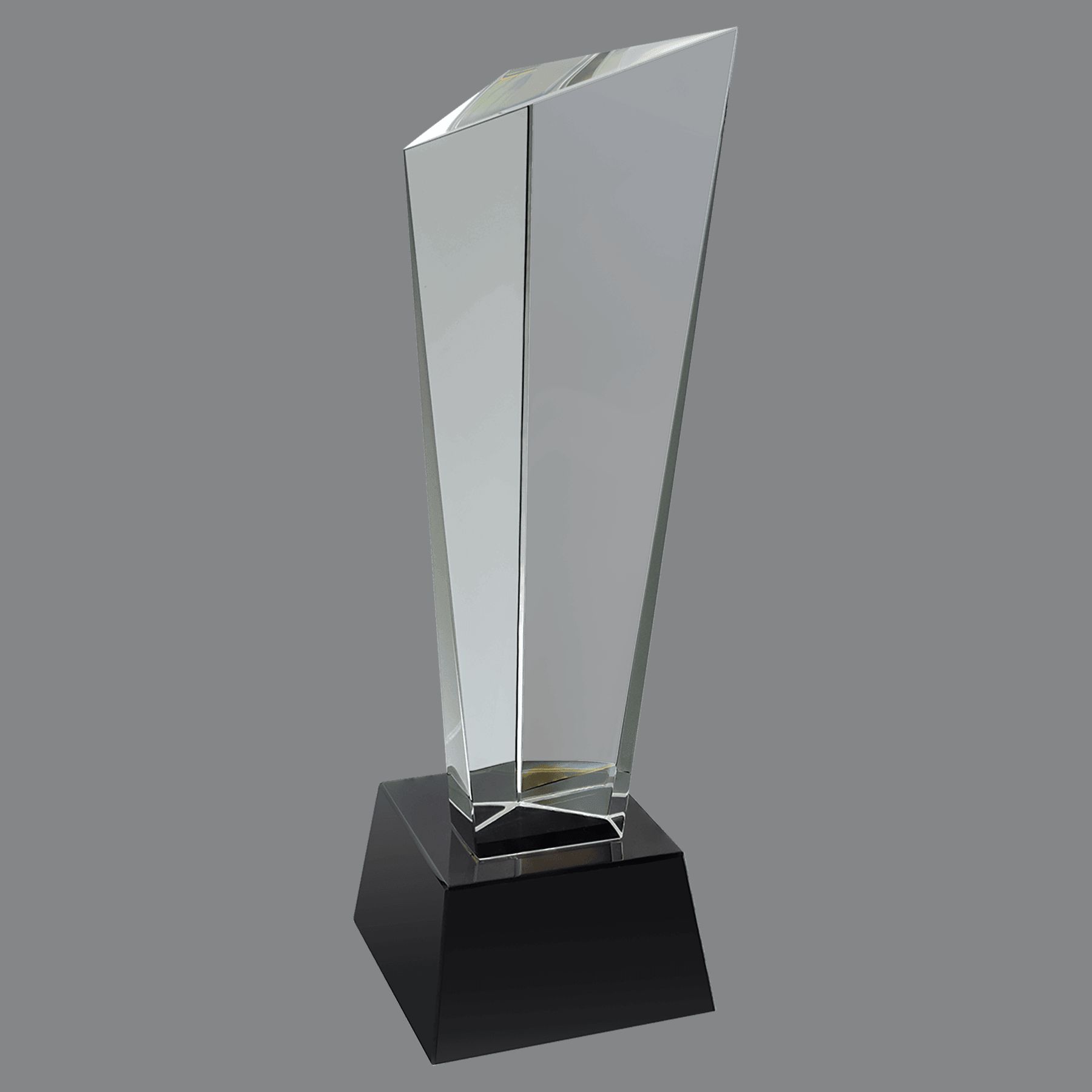 Our Rising Peak Crystal Award is the taller version of this award. It stands 11" tall, weighs 5.6 lbs & comes in a deluxe gift box. The top of the award is a clear piece of crystal with 3 corners, one of which is higher than the other two. It's mounted on a black crystal base.