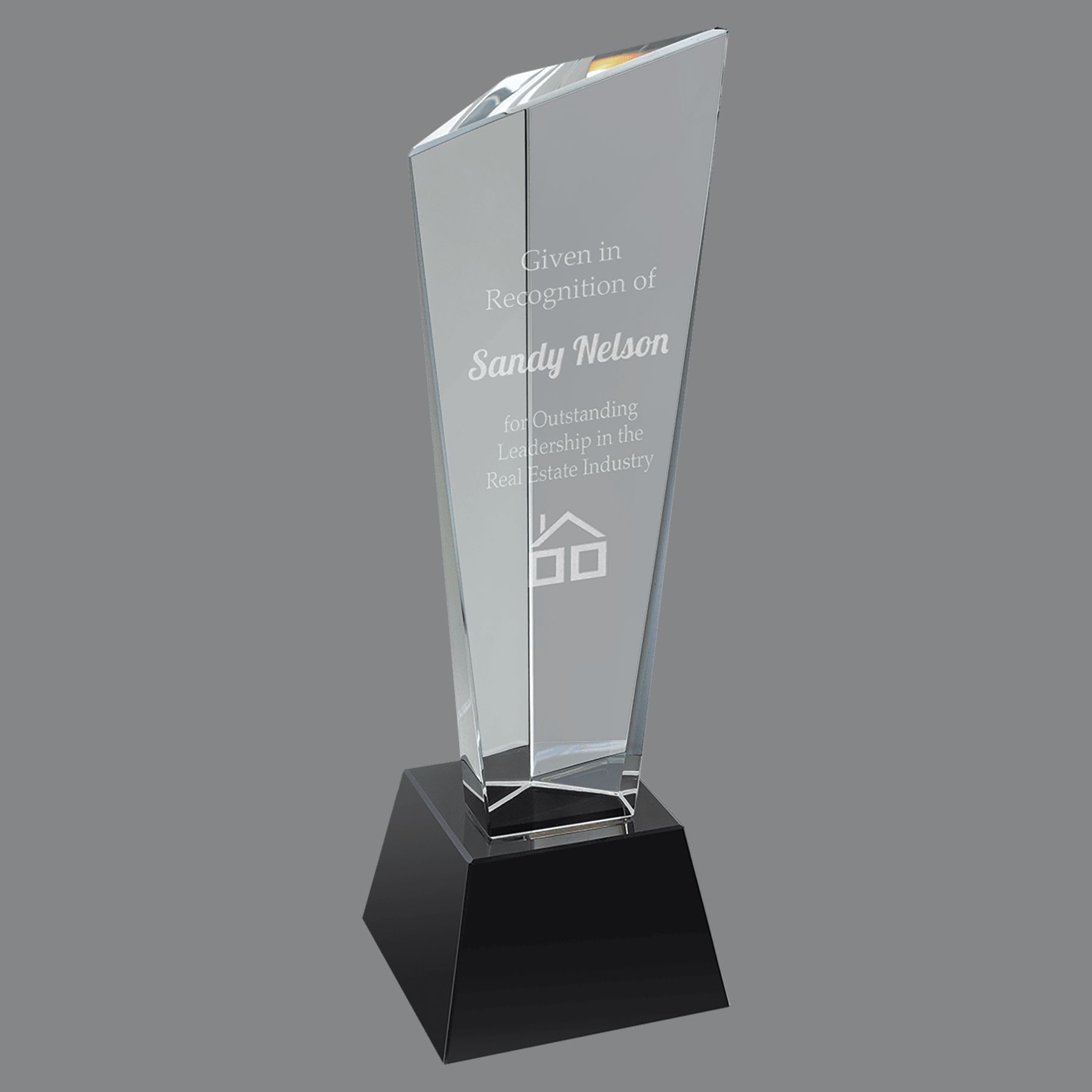 Our Rising Peak Crystal Award CRY23010M is the smaller size of this award. It's 10" tall, weighs 4.3 lbs & comes in a deluxe gift box. It features a tall crystal piece with three points, one higher than the other two, thus giving the rising peak look. It's mounted on a black crystal base.