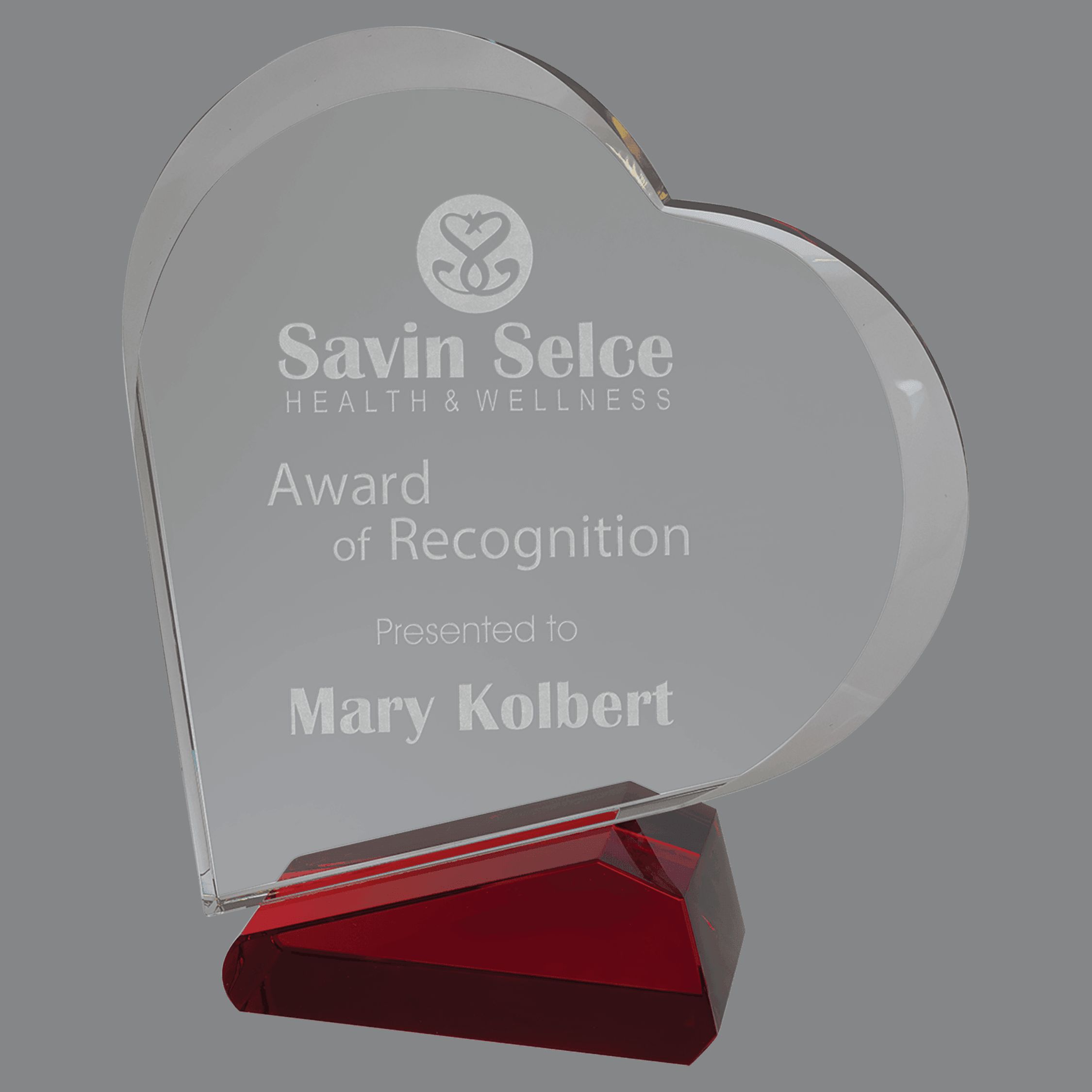 Our Slanted Crystal Heart features a clear crystal heart that is slanted as it's mounted on a red crystal base. The clear crystal base is for laser engraving personalization.