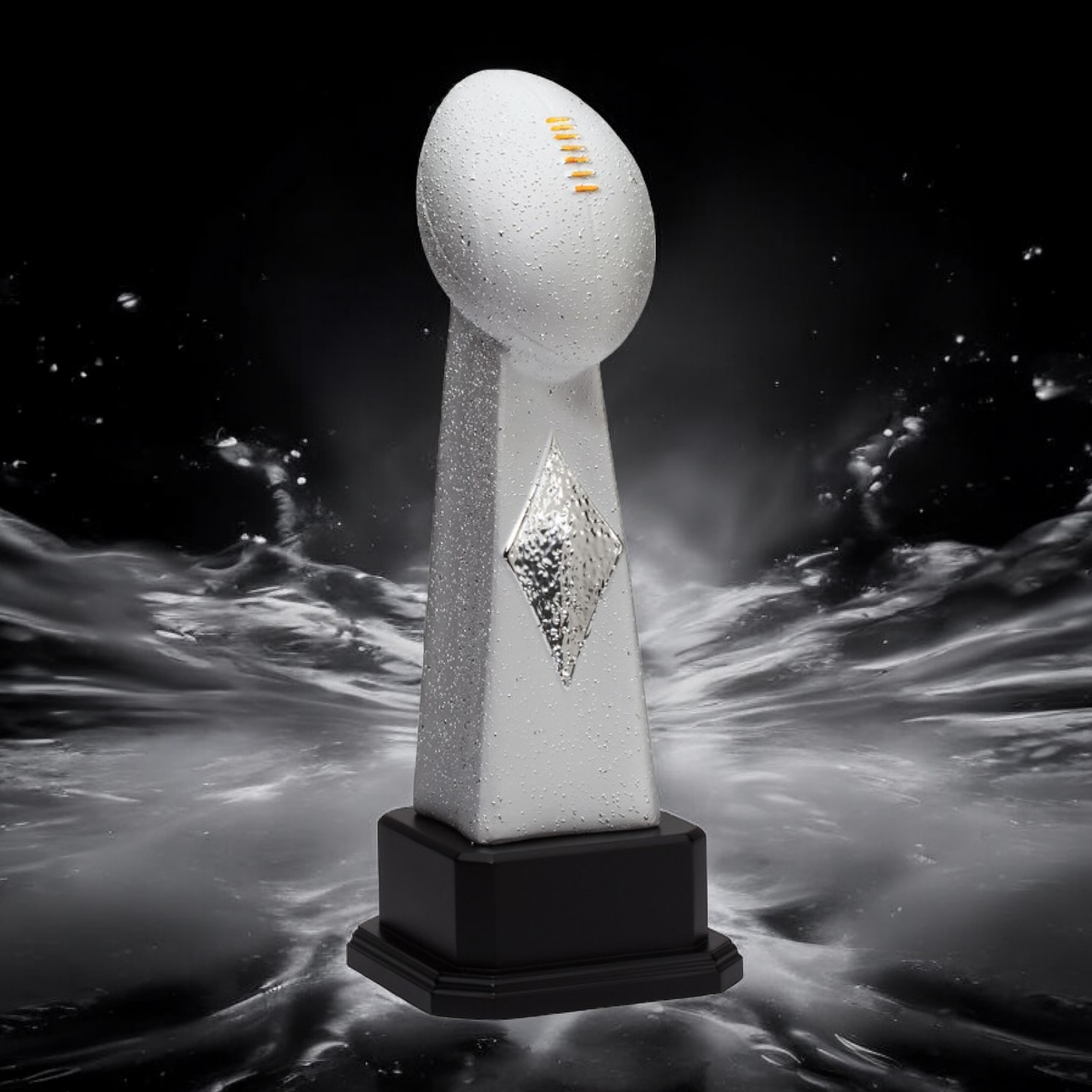 Our Ceramic Football Trophy features a frosted silver imitation Lombardi Trophy. The top features silver football with gold laces. The middle area has a shiny silver diamond. It's all mounted on a black wood base that includes an engraving plate for personalization. The engraving plate is not shown in this photo. The football trophy is displayed on a black area with a computer graphic white water splash. It comes in 3 sizes to choose from: 16", 18.5" & 21.5" tall.
