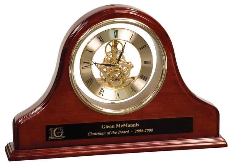 Our Grand Piano Mantel Clock is made with rosewood & coated with piano finish for a sleek look. The clock is a works is a gold skeleton clock with black hands. Below the clock is a black & gold engraving plate that is laser engraved with a company logo, a name & additional text of Chairman of the Board. This GP03 Mantel Clock is 9" tall, 13.25" wide & includes both free engraving & free shipping.