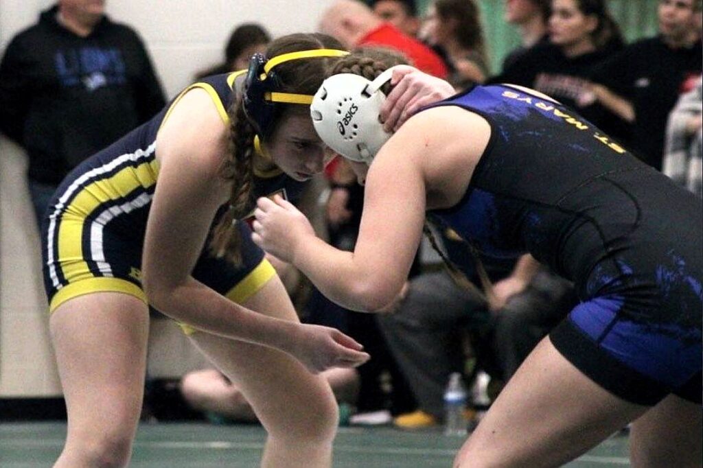 Elsie Mello of the Archbold Blue Streaks Girls Wrestling Team in a match with a competitor from St. Mary's High School.